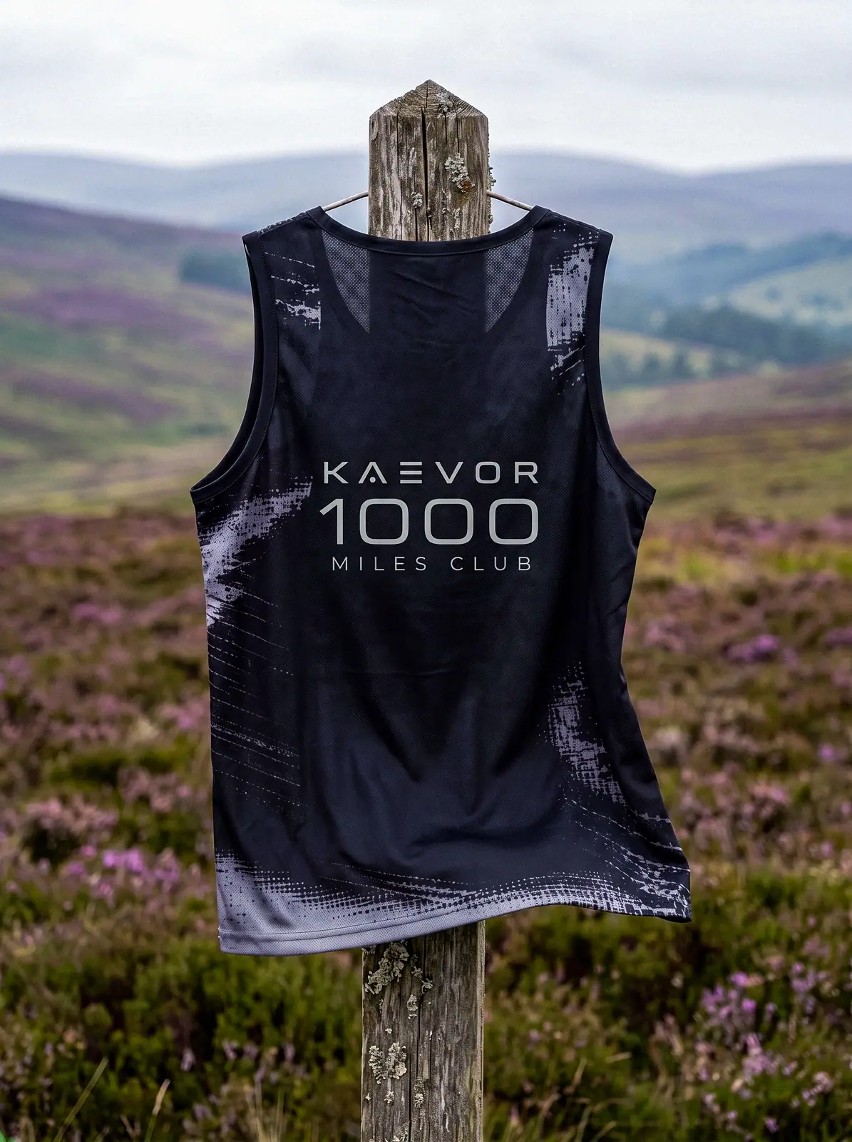 The 1000 Miles Club vest on a fence post